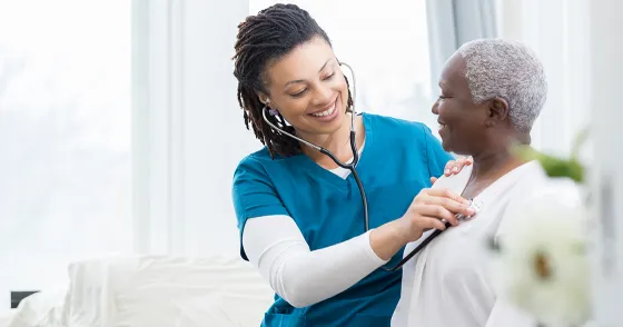 Vascular - Healthcare nurse checks a senior female patient 